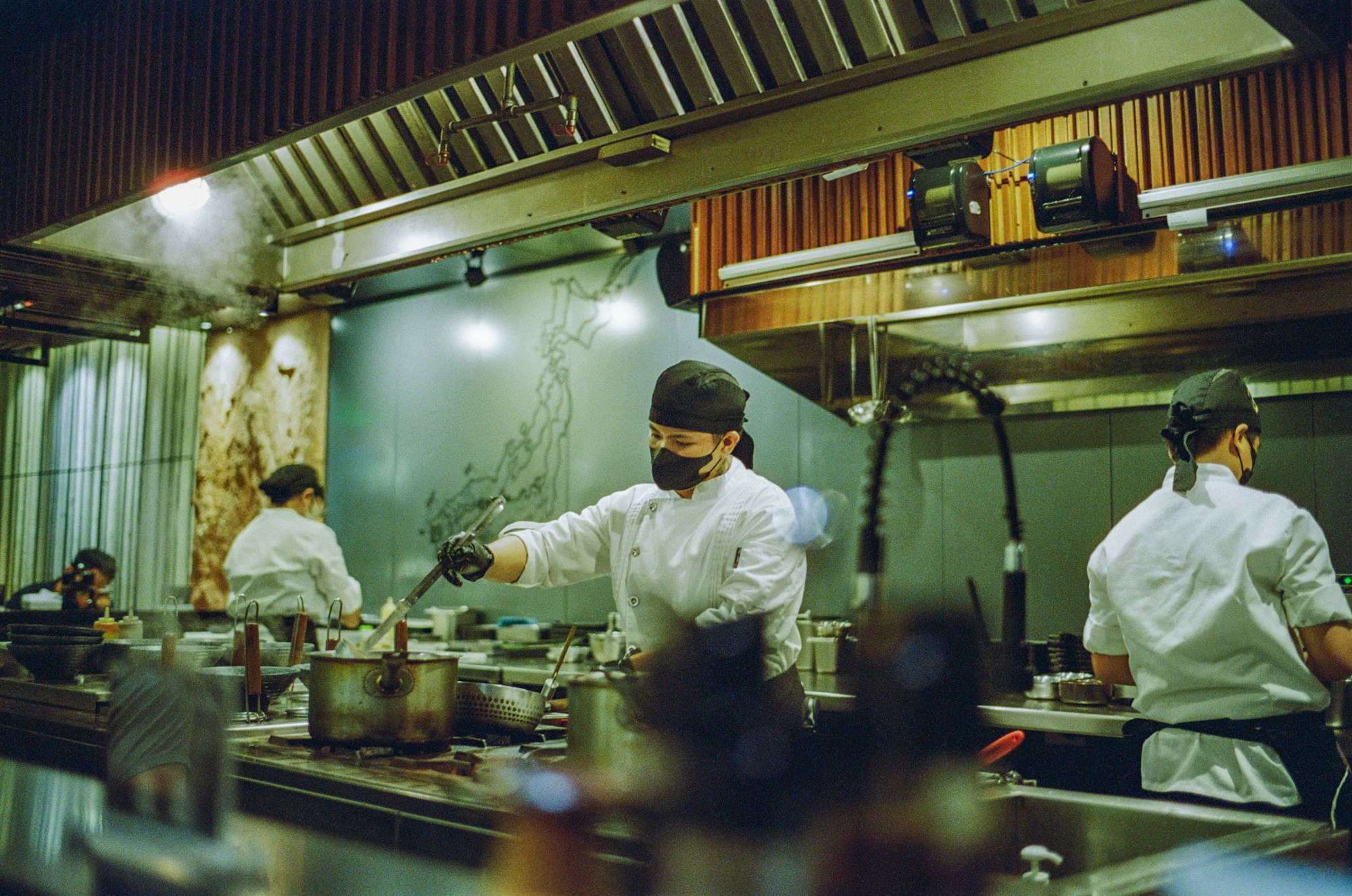 Chefs working together in a professional restaurant kitchen